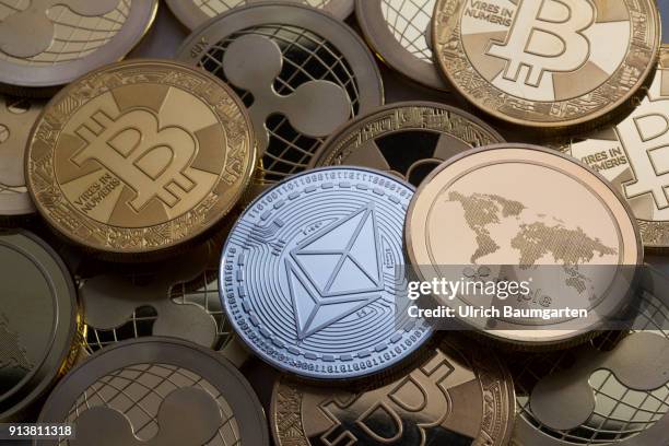 Symbol photo on the topics cryptocurrency, digital currency, Speculation, currency speculation, etc. The picture shows Ethereum, Bitcoin and Ripple...