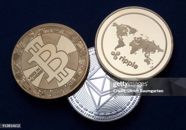 Symbol photo on the topics cryptocurrency, digital currency, Speculation, currency speculation, etc. The picture shows Ethereum, Bitcoin and Ripple...