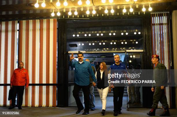 Venezuelan President Nicolas Maduro arrives with First Lady Cilia Flores and Vice President Tarek El Aissami , to attend a rally in Caracas on...