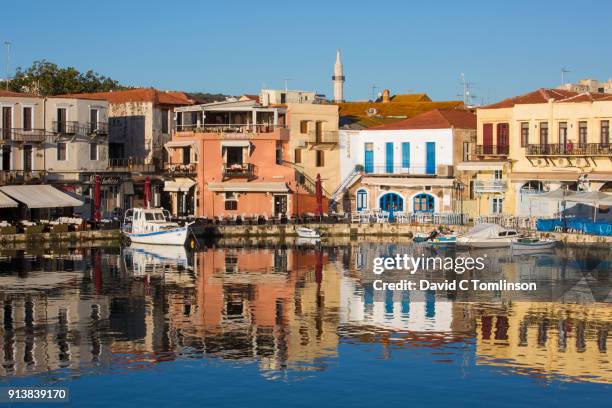 view across the venetian harbour to colourful buildings, early morning, rethymno, crete, greece - crete rethymnon stock pictures, royalty-free photos & images