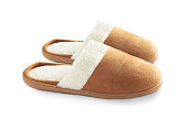a pair of suede slippers