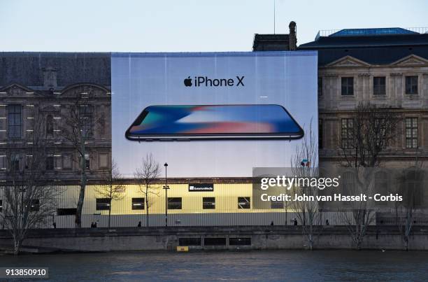Advertising is displayed on a gigantic canvas for the iPhone X on the Louvre on February 02, 2018 in Paris, France. With stagnant sales of iPhone X,...