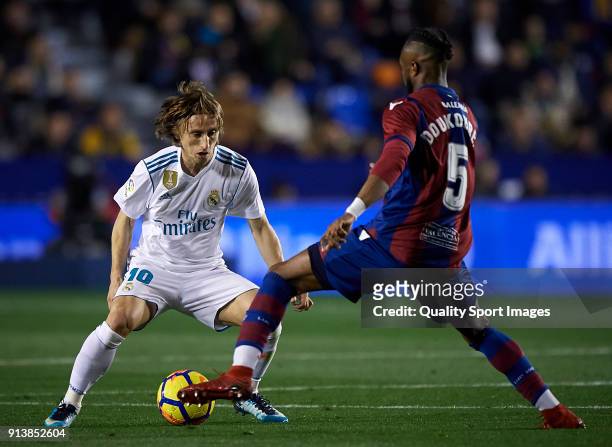 Cheik Doukoure of Levante competes for the ball with Luka Modric of Real Madrid during the La Liga match between Levante and Real Madrid at Ciutat de...