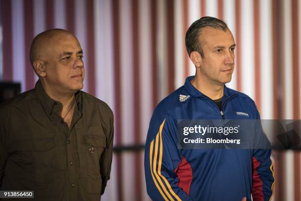 Jorge Rodriguez, Venezuela's information minister, left, and Tareck El Aissami, Venezuela's vice president, listen as Nicolas Maduro, Venezuela's...