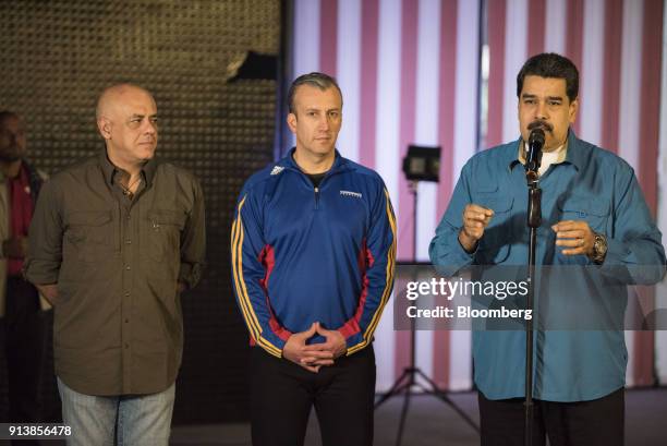 Nicolas Maduro, Venezuela's president, right, addresses members of the media as Tareck El Aissami, Venezuela's vice president, center, and Jorge...