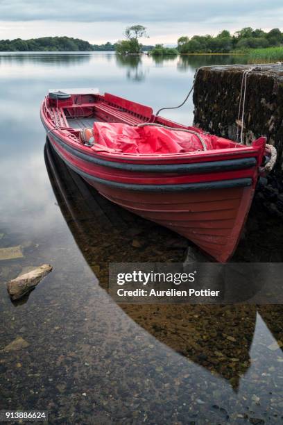 lough leane, red boat - lakes of killarney stock pictures, royalty-free photos & images