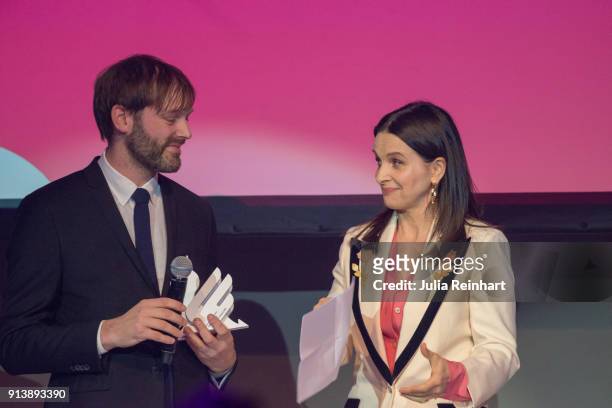 Actress Juliette Binoche accepts the Honorary Dragon Award from Artistic Director for the Gothenburg Film Festival Jonas Holmberg at the Gothenburg...