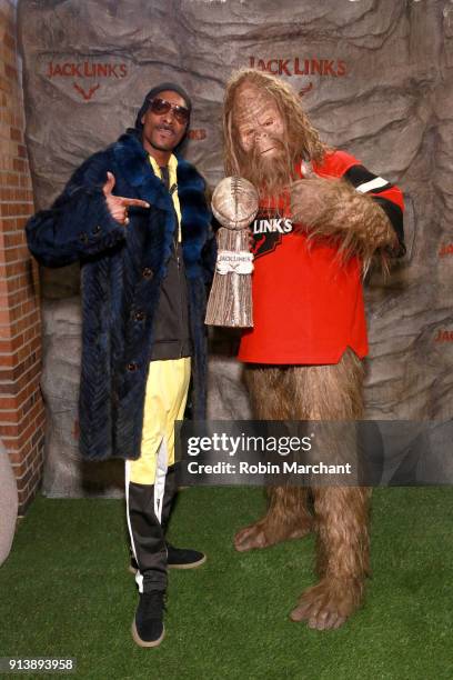 Snoop Dogg and Jack Link's Sasquatch attend the Jack Link's Legend Lounge to kick-off the protein snacking company's pre Super Bowl festivites on...