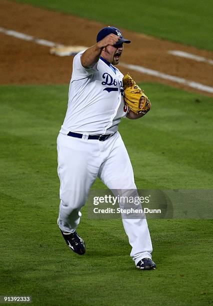 Pitcher Jonathan Broxton of the Los Angeles Dodgers celebrates after getting the final out against the Colorado Rockies on October 3, 2009 at Dodger...