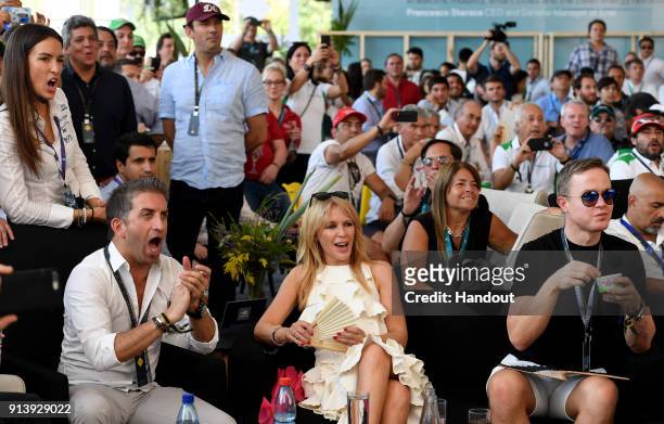In this handout provided by FIA Formula E - Kylie Minogue watches the race during the Santiago ePrix, Round 4 of the 2017/18 FIA Formula E Series on...