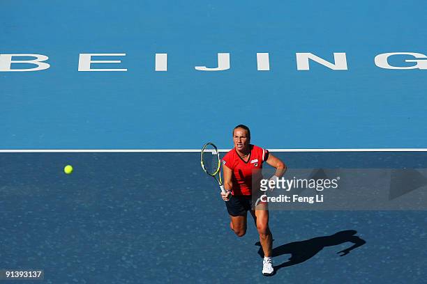 Svetlana Kuznetsova of Russia returns a shot against Zheng Jie of China in her first round match during day three of the 2009 China Open at the...