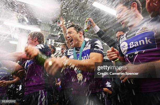 Storm players sing their team song and celebrate in their changeroom after winning the 2009 NRL Grand Final match between the Parramatta Eels and the...