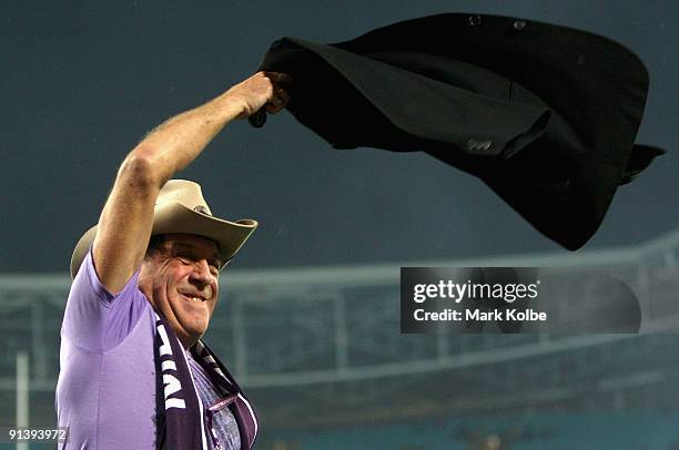 Media personality Molly Meldrum celebrates after the Storm's victory in the 2009 NRL Grand Final match between the Parramatta Eels and the Melbourne...