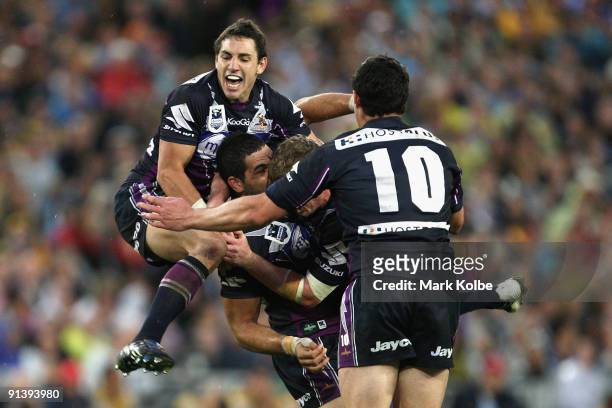 Billy Slater celebrates with Greg Inglis of the Storm after he kicked a field goal during the 2009 NRL Grand Final match between the Parramatta Eels...
