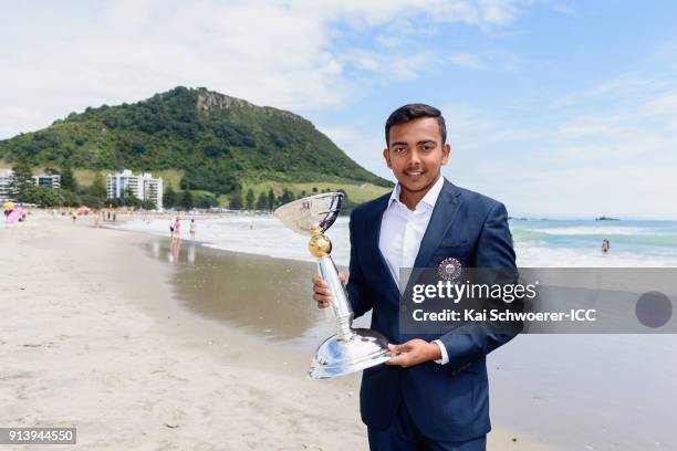 Captain Prithvi Shaw of India poses with the trophy during the ICC U19 Cricket World Cup media opportunity at Mount Maunganui Beach on February 4,...