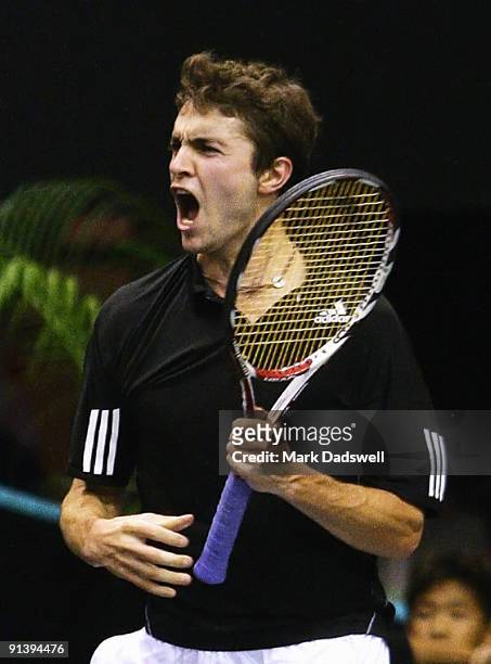 Gilles Simon of France celebrates match point in his singles finals match against Viktor Troiki of Serbia during day nine of the 2009 Thailand Open...