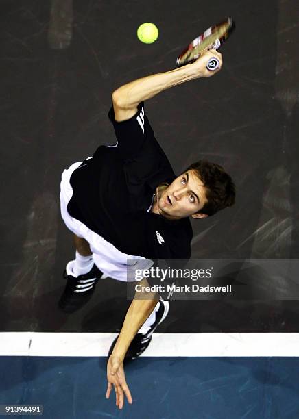 Gilles Simon of France serves in his singles finals match against Viktor Troiki of Serbia during day nine of the 2009 Thailand Open at Impact Arena...