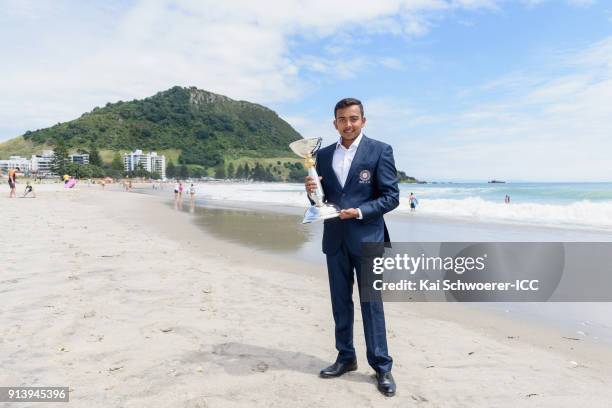 Captain Prithvi Shaw of India poses with the trophy during the ICC U19 Cricket World Cup media opportunity at Mount Maunganui Beach on February 4,...
