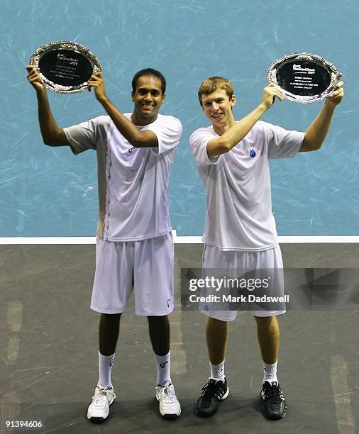 Rajeev Ram and Eric Butorac of the USA hold their 2009 PTT Thailand Open Doubles trophies after defeating Guillermo Garcia-Lopez of Spain and Mischa...