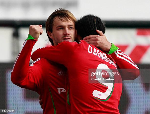 Dmitri Sychev and Peter Odemwingie of FC Lokomotiv Moscow celebrate after scoring a goal during the Russian Football League Championship match...