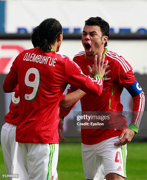 Rodolfo and Peter Odemwingie of FC Lokomotiv Moscow celebrate after scoring a goal during the Russian Football League Championship match between FC...