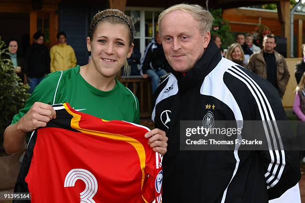 Luisa Wensing of Niederrhein receives a national shirt by Ralf Peter, sports director of the tournament, during the Women's U17 Federal State Cup at...