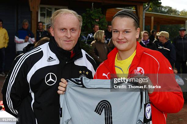 Friederike Abt of Westfalen receives a national shirt by Ralf Peter, sports director of the tournament, during the Women's U17 Federal State Cup at...
