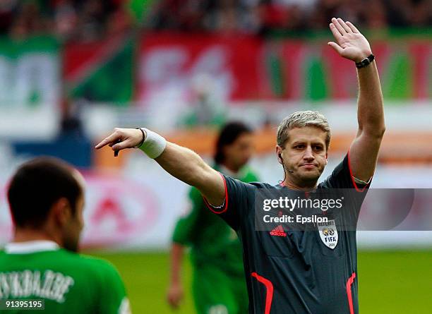 The referee Stanislav Sukhina gestures during the Russian Football League Championship match between FC Lokomotiv Moscow and FC Rubin Kazan at the...