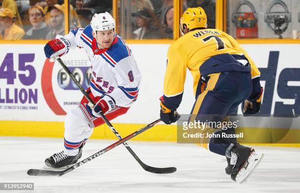 Cody McLeod of the New York Rangers skates against Yannick Weber of the Nashville Predators during an NHL game at Bridgestone Arena on February 3,...