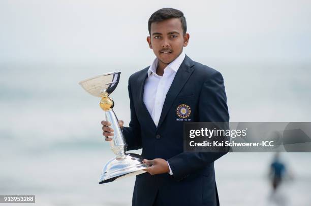 Captain Prithvi Shaw of India poses with the trophy during the ICC U19 Cricket World Cup media opportunity at Mount Maunganui Beach on February 4,...