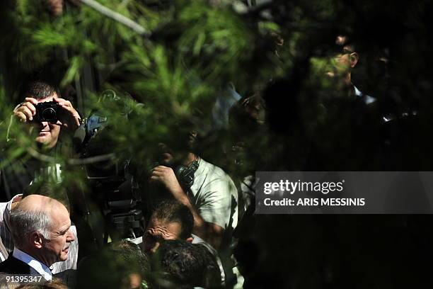 Greek main opposition leader, President of the Greek socialist party PASOK, George Papandreou exits a polling station after voting during Greece's...