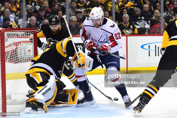 Evgeny Kuznetsov of the Washington Capitals drives with the puck against Matt Murray of the Pittsburgh Penguins at PPG PAINTS Arena on February 2,...