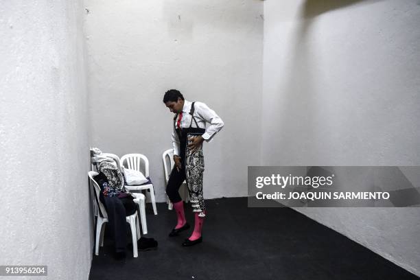 Banderillero gets dressed before a bullfight at La Macarena bullring in Medellin, Colombia, on February 3, 2018. / AFP PHOTO / JOAQUIN SARMIENTO