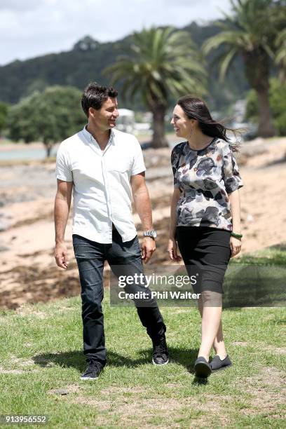 Prime Minister Jacinda Ardern walks with her partner Clarke Gayford on February 4, 2018 in Waitangi, New Zealand. Ardern and Gayford are expecting...