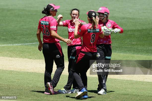 Sarah Coyte of the Sixers celebrates the wicket of Heather Graham of the Scorchers during the Women's Big Bash League final match between the Sydney...