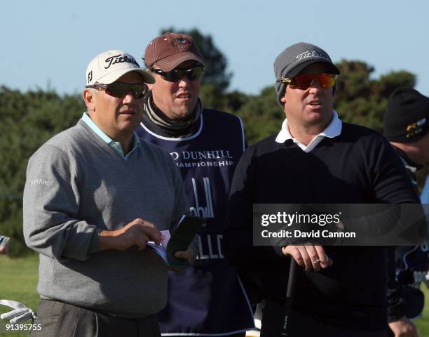 Shane Warne of Australia on the tee at the 15th hole with his professional partner Peter O'Malley of Australia during the third round of the Alfred...