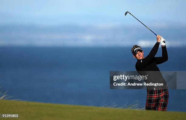 Luke Donald of England plays his second shot to the fifth hole during the third round of The Alfred Dunhill Links Championship at Kingsbarns Golf...