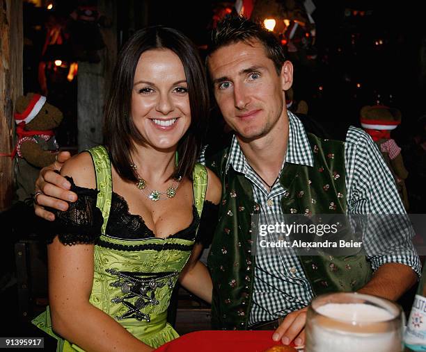 Miroslav Klose of Bayern Muenchen and his wife Sylwia attend the Oktoberfest beer festival at the Kaefer Wiesnschaenke tent on October 4, 2009 in...