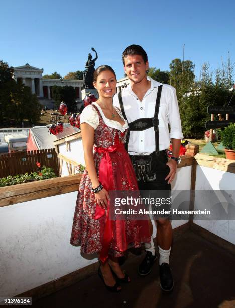 Mario Gomez of Bayern Muenchen and girlfriend Silvia Meichel attend the Oktoberfest beer festival at the Kaefer Wiesnschaenke tent on October 4, 2009...
