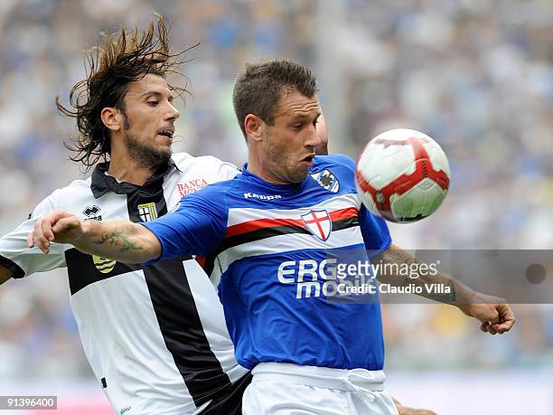 Antonio Cassano of UC Sampdoria competes for the ball with Cristian Zaccardo of Parma FC during the Serie A match between UC Sampdoria and Parma FC...