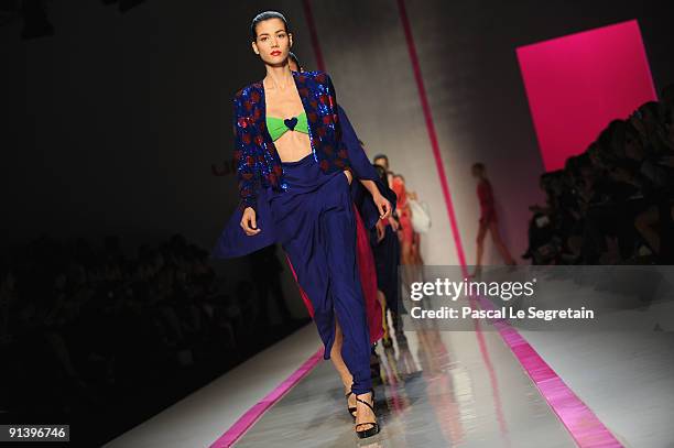 Model walks the runway during the Emmanuel Ungaro Pret a Porter show as part of the Paris Womenswear Fashion Week Spring/Summer 2010 at Le Carrousel...