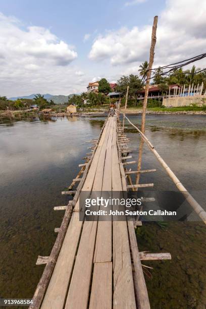 wooden bridge in vang vieng - nam song river stock pictures, royalty-free photos & images
