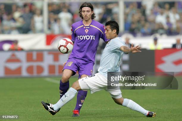 Riccardo Montolivo of ACF Fiorentina in action against Francelino Da silva Matuzalem of SS Lazio during the Serie A Tim match between ACF Fiorentina...