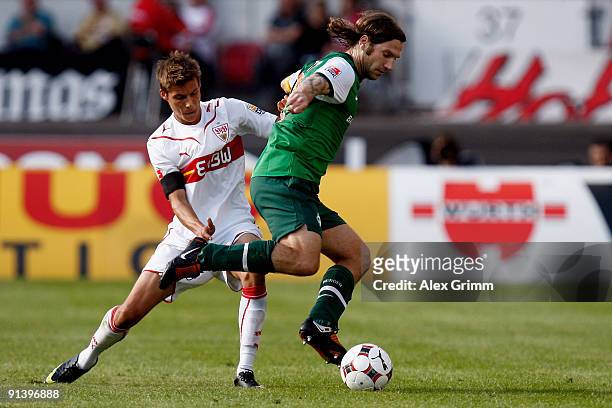 Torsten Frings of Bremen is challenged by Clemens Walch of Stuttgart during the Bundesliga match between VfB Stuttgart and SV Werder Bremen at the...