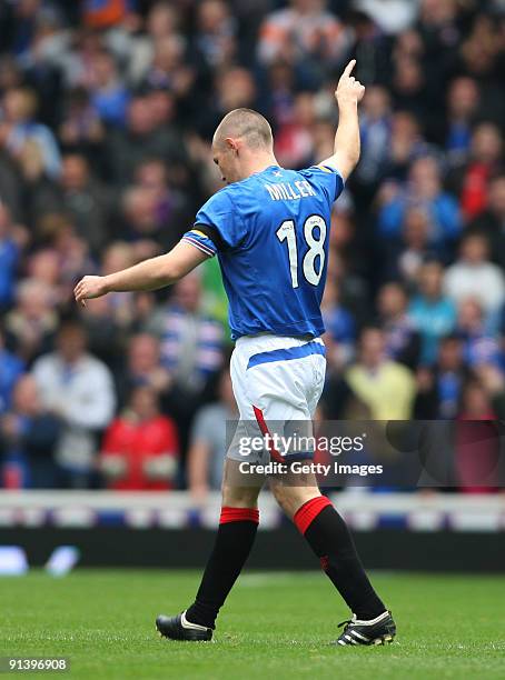 Kenny Miller of Rangers celebrates his first goal during the Clysdale Bank Scottish Premier League match between Rangers and Celtic at Ibrox on...