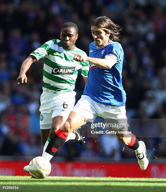 Pedro Mendes of Rangers and Landry N'Guemo of Celtic in action during the Clysdale Bank Scottish Premier League match between Rangers and Celtic at...