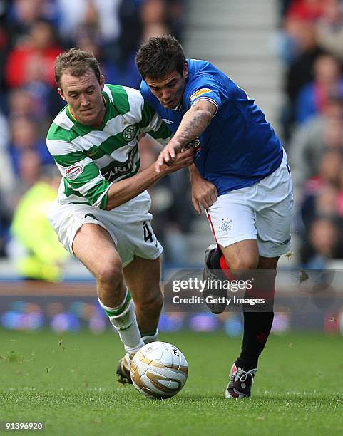 Aiden McGeady of Celtic and Nacho Novo of Rangers in action during the Clydesdale Bank Scottish Premier League match between Rangers and Celtic at...