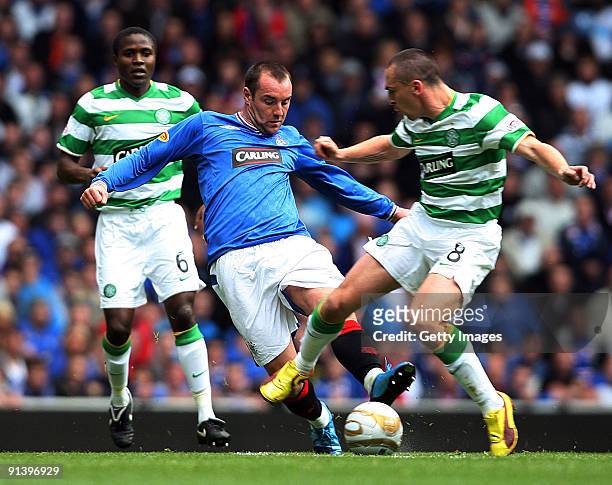 Landy N'Guemo of Celtic, Kris Boyd of Rangers and Scott Brown of Celtic in action during the Clydesdale Bank Scottish Premier League match between...
