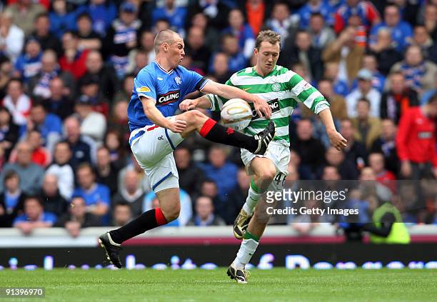 Aiden McGeady of Celtic and Kenny Miller of Rangers in action during the Clydesdale Bank Scottish Premier League match between Rangers and Celtic at...