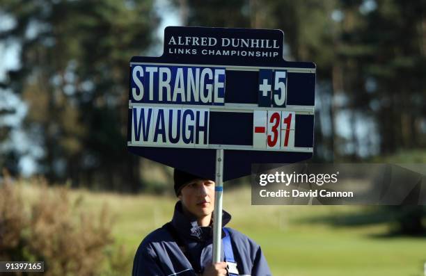 Steve Waugh of Australia outshines his playing partner professional Scott Strange of Australia as the roving scoreboard shows at the 9th hole during...